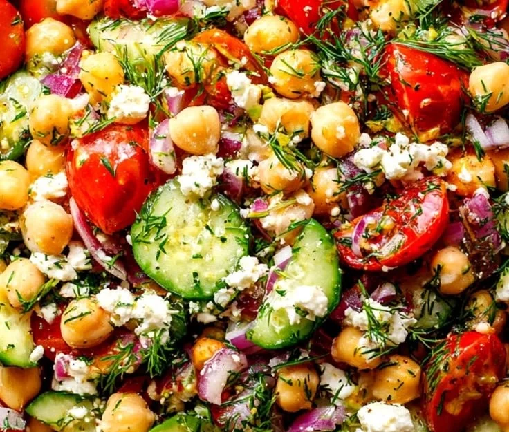 High-protein chickpea and cucumber salad served in a bowl with fresh vegetables