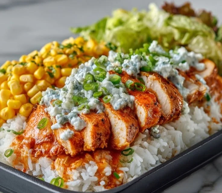 Buffalo Chicken Protein Bowl with vegetables and grains for a healthy meal.