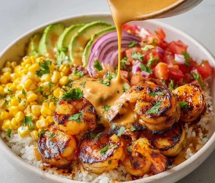 Healthy grilled shrimp bowl with fresh vegetables and quinoa