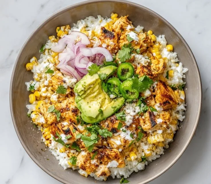 Delicious Mexican Street Corn Chicken Bowls with vibrant toppings and ingredients.