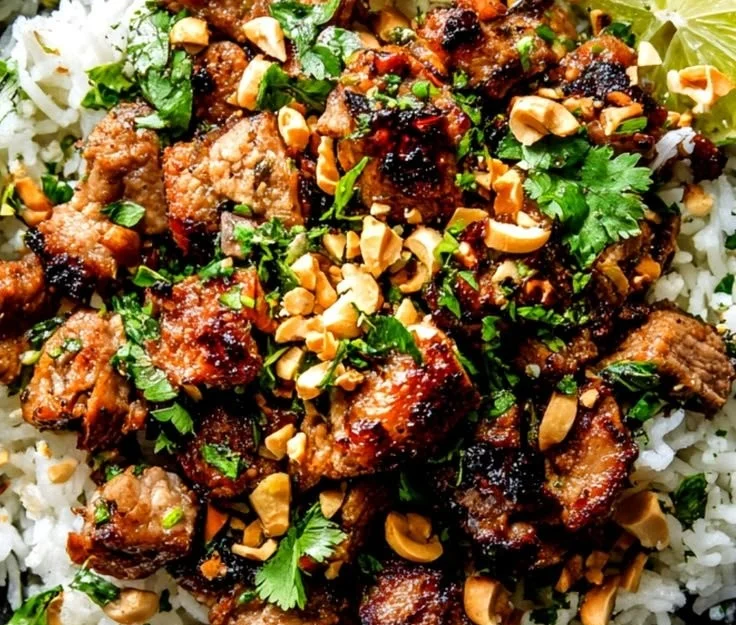 Zesty ginger lime pork dish served on a plate with vibrant garnishes.