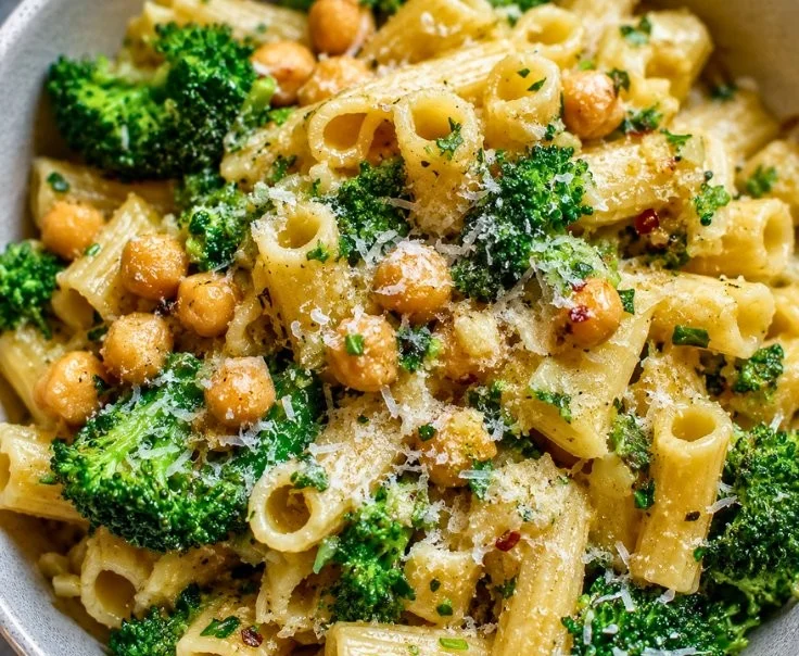 Delicious bowl of broccoli chickpea pasta with vibrant vegetables and spices