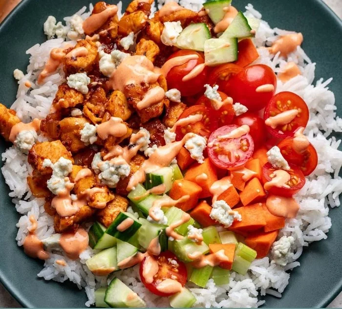 Delicious Buffalo Chicken Bowl with toppings and crispy veggies