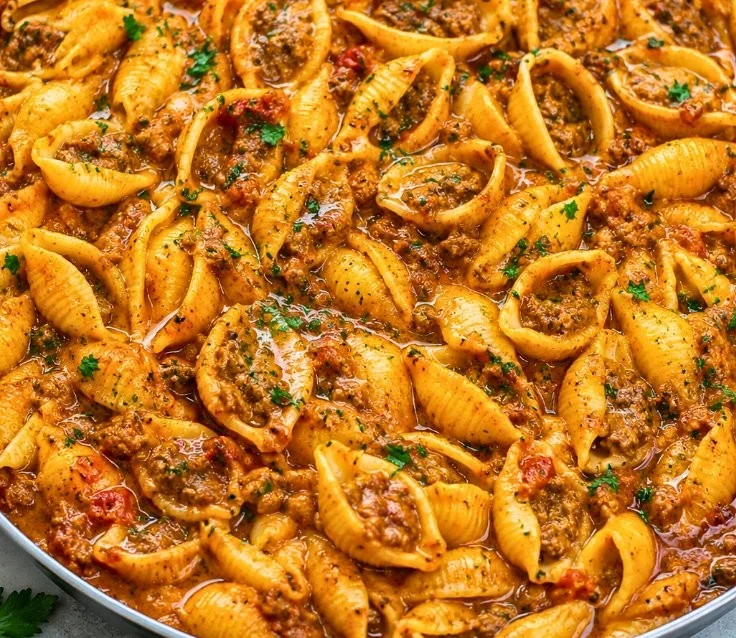 Delicious creamy beef and shells served in a bowl, perfect for family dinner.