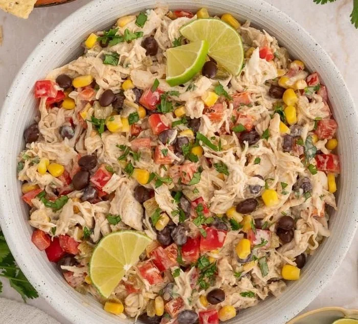 Healthy taco chicken salad with fresh ingredients in a bowl