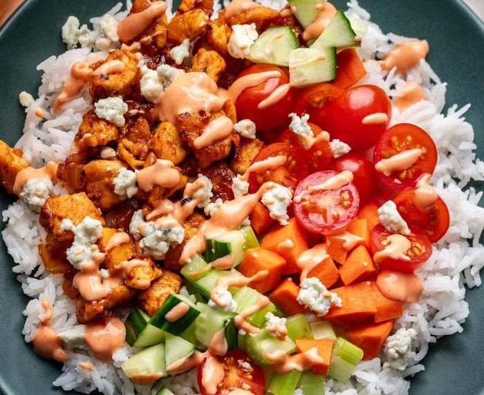 Healthy Buffalo Chicken Bowls with fresh ingredients and spicy sauce