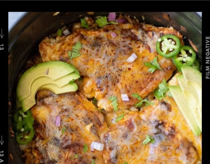 Healthy chicken fajita casserole in a baking dish with colorful bell peppers and chicken.
