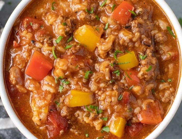 Bowl of high protein stuffed pepper soup with colorful peppers and vegetables