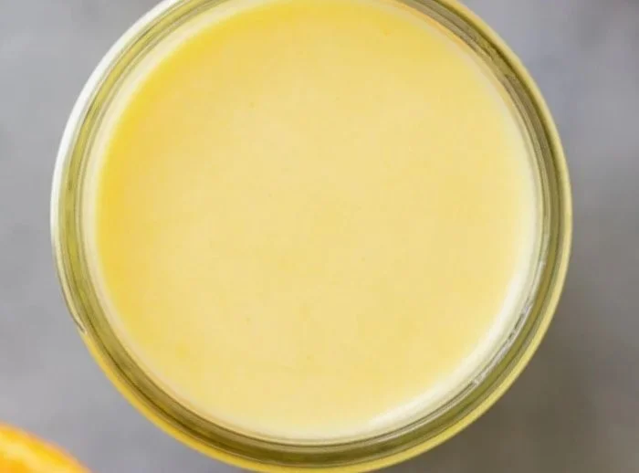 Homemade citrus dressing in a jar, ideal for healthy salads