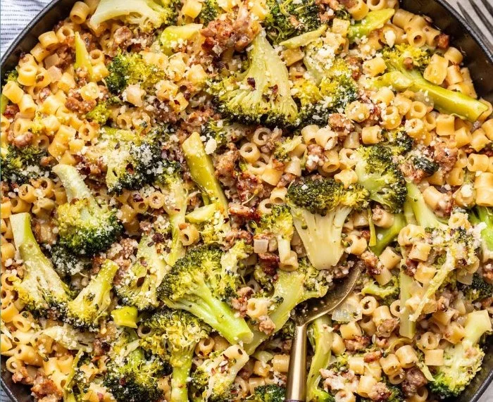 One Pot Sausage Broccoli Pasta in a bowl with fresh ingredients