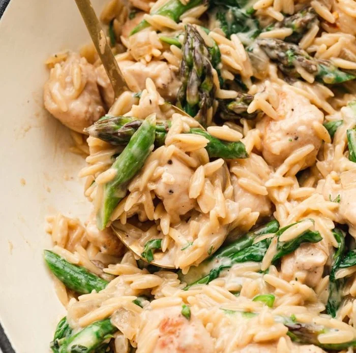 Delicious chicken orzo dish with vegetables and herbs, perfect for a cozy dinner.