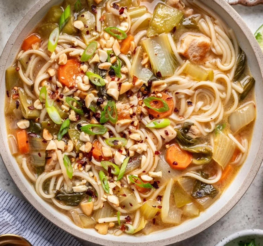 Thai Inspired Chicken Soup with lemongrass and coconut in a cozy bowl
